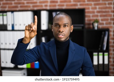 African American Man Raising Hand To Ask Question