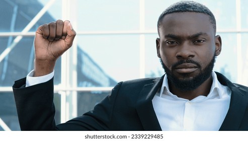 African American man is raising his Hand, a Sign of Protest, Black Lives Matter. Raised Black Man's fist in Protest. Social justice and Peaceful protesting racial Injustice.