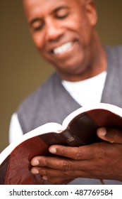 African American man reading the Bible.
