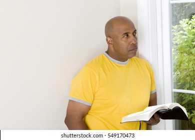 African American man reading the Bible