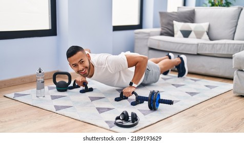 African American Man Smiling Confident Training Push Up At Home