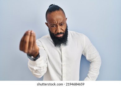 African American Man Standing Over Blue Background Doing Italian Gesture With Hand And Fingers Confident Expression 