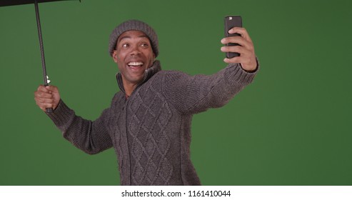 An African American Man Takes A Selfie In The Rain On Green Screen