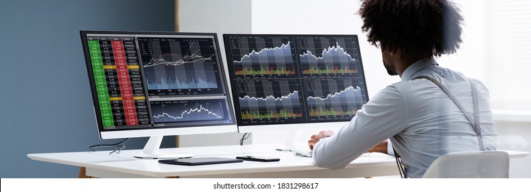 African American Man Trading Stock Market Online On Computer - Shutterstock ID 1831298617