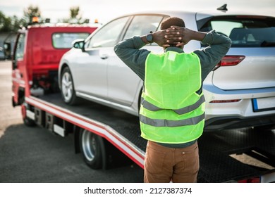 African American Man Using Towing Service For Help Car Accident On The Road. Roadside Assistance Concept.