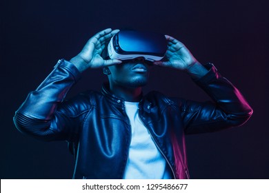 African american man in vr glasses, watching 360 degree video with virtual reality headset isolated on black background