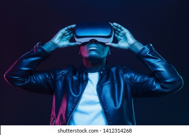 African american man in vr glasses, watching 360 degree video with virtual reality headset isolated on black background - Powered by Shutterstock
