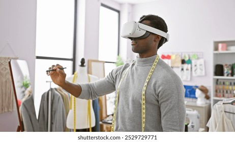 African american man wearing virtual reality headset in a modern tailoring atelier, with measuring tape around his neck. - Powered by Shutterstock