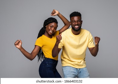 African American Man And Woman Happy For Win, Excited Ethnic Couple In Spectacles Feel Overjoyed Receiving Good News Being Successful Isolated On Grey Studio Background