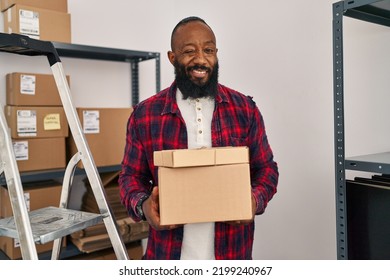 African American Man Working At Small Business Ecommerce Winking Looking At The Camera With Sexy Expression, Cheerful And Happy Face. 