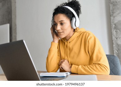 African American Mixed Race Adult Student Wearing Headphones Having Virtual Meeting Online Call With Friends, Educational Webinar Chatting At Home Office. Video E Learning Conference Call On Pc.