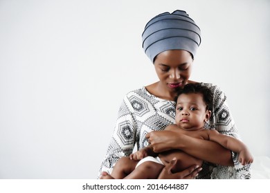 African American Mother Holding Her Adorable Infant Baby Son With Love