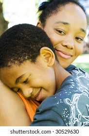 African American Mother Hugging Son