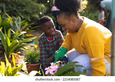 African american mother and son spending time together in the garden and gardening. Family time, garden, gardening. - Powered by Shutterstock