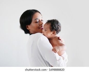 African American mum is comforting a baby on a white background. - Powered by Shutterstock