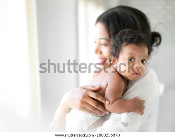 African American Mum Comforting Baby On Stock Photo (Edit Now) 1880236870