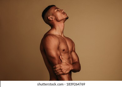 https://image.shutterstock.com/image-photo/african-american-muscular-man-standing-260nw-1839264769.jpg