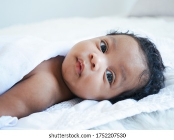 African American Newborn Looking Camara.