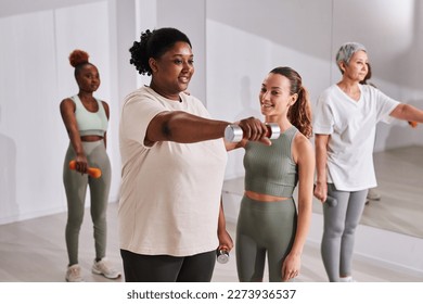 African American overweight woman training with instructor in gym, she doing exercises on biceps by lifting dumbbells - Powered by Shutterstock