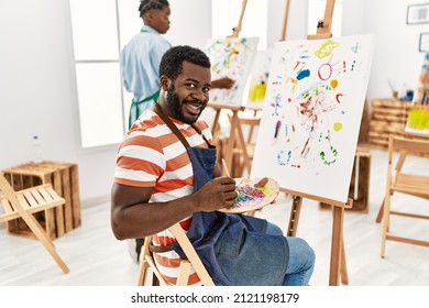 African American Painter Couple Smiling Happy Painting At Art Studio.