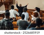 African american pastor leads a diverse congregation in prayer inside a beautiful church, creating a moment of togetherness and spiritual connection