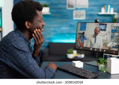 African American Patient Having Painful Teeth Illness Discussing Pain Treatment With Remote Doctor During Online Appointment On Videocall Meeting Conference. Videoconference Telehealth Virtual Call