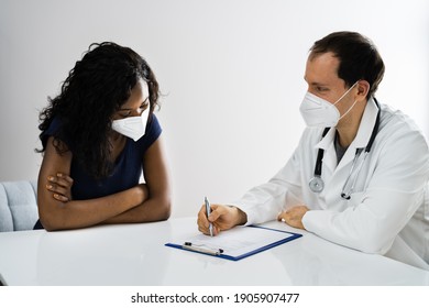 African American Patient At Hospital Meeting Doctor In Face Mask