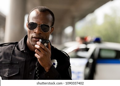 African American Police Officer Talking By Walkie-talkie Radio Set
