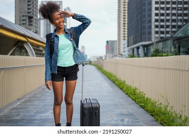 African American Portrait Afro Hair, Portrait Of Black Female Travel City In Metropolis. Wear Headphones Backpack Travel Abroad In City. Smiling Portrait Woman Smile Happy Gesture.