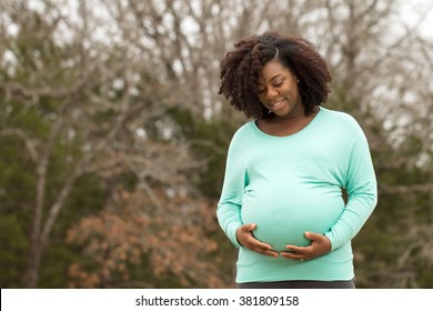 African American Pregnant Woman Outside.