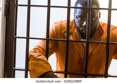 African American Prisoner Leaning On Prison Stock Photo 1030224889 ...