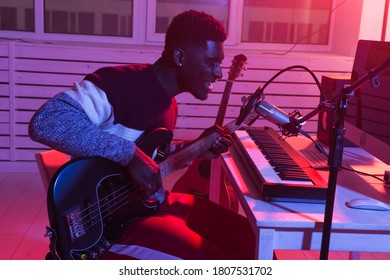 African American Professional Musician Recording Bass Guitar In Digital Studio At Home, Music Production Technology Concept.