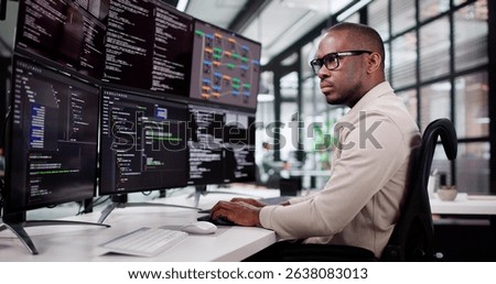African American Programmer Developing Web Software In Office Setting
