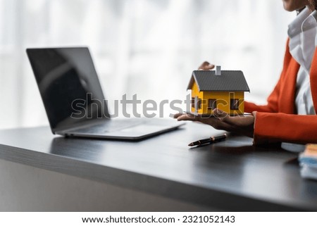 African American realtor working at desk, Housing estate, Vacancy, Prime location, Description of project, Infrastructure, Agency Agreement, Appraisal Price, Electricity Meter and Deposit, Low Rise