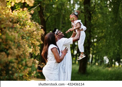 African American Rich Family Having Fun On Sunset. Father Throws Daughter On His Hands