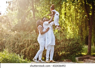 African American Rich Family Having Fun On Sunset. Father Throws Daughter On His Hands