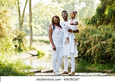 African American Rich Family At White Nigerian National Clothing