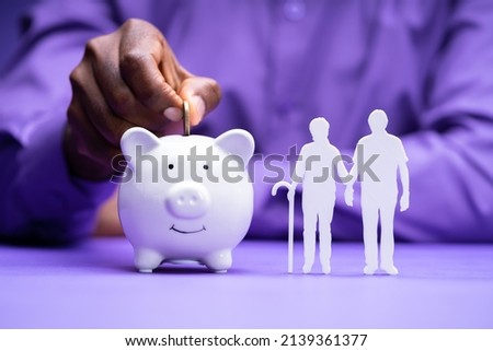 African American Saving In Piggy Bank For Retirement
