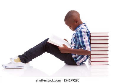 African American school boy reading a book, isolated on white background - Black people