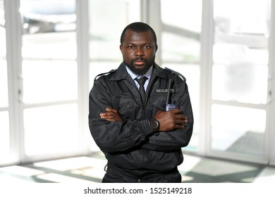 African - American Security Guard In Building