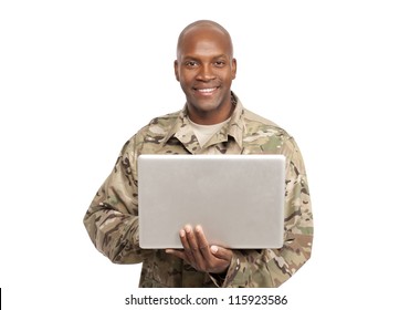 African American Soldier Smiles While Holding A Computer