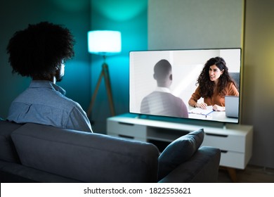 African American Streaming And Watching Movie On TV Screen