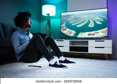 African American Streaming And Watching Movie On TV Screen