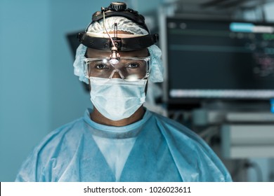 African American Surgeon Looking At Camera In Operating Room