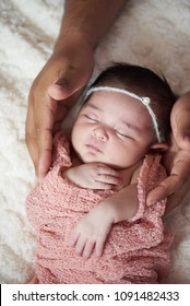 African american take care of white newborn baby. Father hands hold baby girl