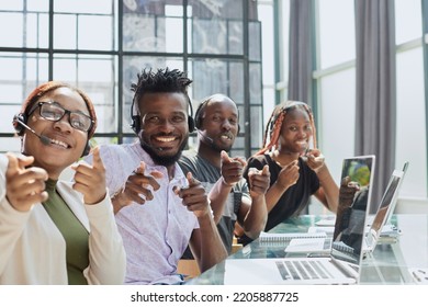 African american team working at call center office to help people with telemarketing assistance - Shutterstock ID 2205887725