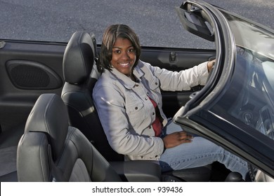 African American Teen Driving In Convertible Auto