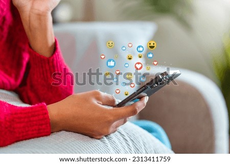 African American teenage woman using a smartphone with Icon communication network social media network pop notification  concept.