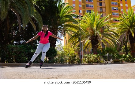 African American teenager skating towards the camera