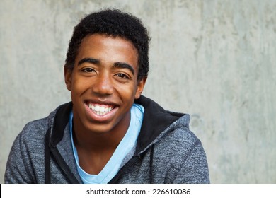 African American Teenager Smiling Looking At The Camera.